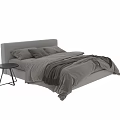Cozy Bedroom Interior With Neutral Tones Bed Pillows Blanket And Black Side Table