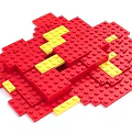 Red and Yellow Building Blocks of Various Shapes Stacked in Creative Arrangement