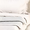 Modern Beige Double Bed With Curved Headboard Pillows Blanket And Side Table