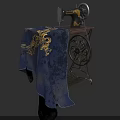 Vintage Sewing Machine With Decorative Blue Fabric And Golden Floral Pattern On Wooden Workbench