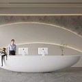 Modern Front Desk Reception Area With White Curved Desk Computers Green Plant And Staff Member