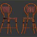 Two Orange Accent Chairs with Pink Plaid Woven Seat and Backrest