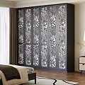 Elegant Black Wardrobe with Intricate Carved Floral Design Panels in Bedroom Setting
