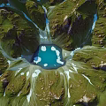 Breathtaking Natural Mountain Landscape With Blue Lake Green Meadows Rocky Peaks And Snowy Patches