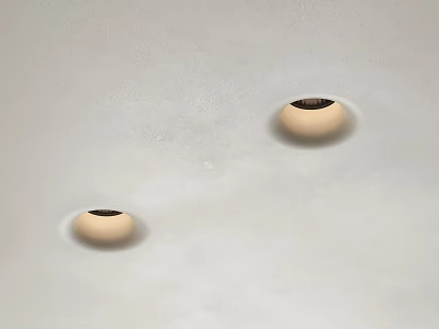 Modern Downlights with Beige Edges and Black Openings Installed on White Slightly Rough Ceiling 3d model
