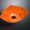 Orange Hand Carved Pottery Sculpture Bowl Shaped With Central Hole And Cracked Details