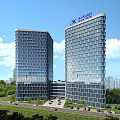 Modern Office Building Exterior With Glass Curtain Walls And Landscaped Entrance Greenery