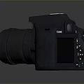 Canon Camera As Electronic Appliance With Black Body And Purple Lens Reflection