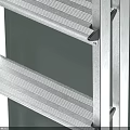 Silver Metal Folding Ladder With Four Steps And Black Handrails Near Light Green Cube
