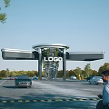 Modern Entrance Gate With Logo And Vehicles Near Pedestrians And Green Trees