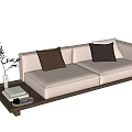 Cream Colored Two Seater Sofa With Wooden Base And Tray Holding Plant And Books
