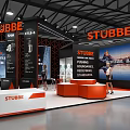 STUBBE Exhibition Booth Design With Orange And Black Display Area Reception Desk And People