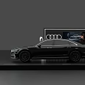 Sleek Black Audi A8L Sedan On Display Platform With Four Rings Logo And Screen