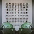 Sofa Background Wall Design With White Wall Arranged Bookshelves Books And Green Transparent Chairs