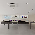Modern Specialty Store Interior With Display Tables Product Screens And Bright Lighting Design
