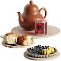 Fresh Homemade Bread with Red Berry Tea Teapot Blueberries and Yellow Green Olives Snack Arrangement
