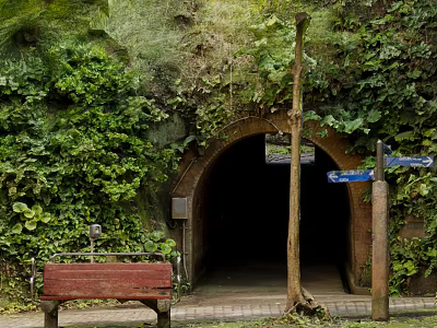 Modern Green Tunnel Entrance With Lush Foliage Red Bench And Signpost 3d model