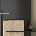 Minimalist Beige Washbasin With Black Faucet And Soap Bottle On Dark Wall