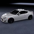 Silver Sports Car Two Door Coupe With Sleek Aerodynamic Body And Black Alloy Wheels
