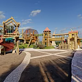 Outdoor Children's Playground With Play Structures Sandpit Green Grass And Aerial View