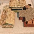 Rural Thatched Houses With Traditional Wooden Structures And Straw Roofs