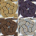 Collection of Braided Knot Shaped Rugs Neatly Arranged On White