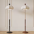Two Modern Floor Lamps With White Patterned Shades And Black Brown Poles For Indoor Decor
