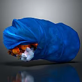 Blue Trash Bag Filled With Various Daily Household Waste Items