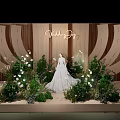 Elegant Wooden Sculpted Wedding Scene With White Dress Green Plants And Flowers