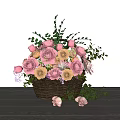 Pink and Beige Flower Arrangement in Wicker Basket with Green Leaves on Wooden Table