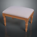 Wooden Stool With Upholstered Light Colored Fabric Seat And Carved Legs