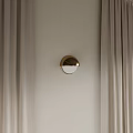 Golden Half Moon Shaped Modern Wall Lamp On Beige Wall With Curtains