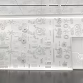 White Wall With Intricate Mechanical Parts And Gear Patterns In Exhibition Space