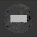 Electronix Electric Vehicle Charging Station With White Black Casing And Orange Bollards On Circular Base