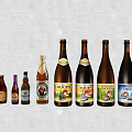 Assorted Wine and Beer Bottles With Glasses in Colorful Display Arrangement