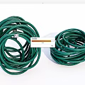 Green Garden Hoses Coiled In Two Rolls For Outdoor Watering Applications