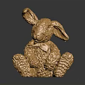 Decorative Golden Rabbit Figurine Sitting With Textured Metallic Surface On Black Reflective Base