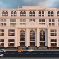 Grand Multi Storey White Classical Commercial Complex With Arched Windows And Street Traffic