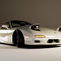 White Modified Sports Car with Alloy Wheels Red Brake Calipers and Sporty Exterior Design