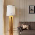 Cozy Living Room With Wooden Floor Lamp White Lampshade Brown Sofa And Geometric Cushion