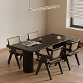 Black Dining Table Set With Cylindrical Legs Four Woven Chairs Wooden Floor And Pendant Light