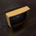 Vintage Television With Cracked Screen Yellow And Silver Casing Classic Design