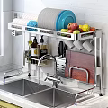 Stainless Steel Kitchenware Rack with Plates Bowls Knives Cutting Board and Spice Bottles Near Sink