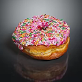 Pink Frosted Donut With Colorful Sprinkles On Black Background With Reflection
