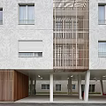 Modern Multi Storey Residential Building With White Exterior Wooden Elements And Street Lamps