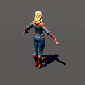 Woman In Superhero Uniform With Blue Red And Gold Accents Standing With Arms Outstretched