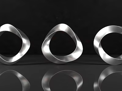 DP Device Displaying Three Silver Ring Shaped Objects With Smooth Metallic Surface And Reflections 3d model