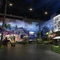 Historical Military Exhibition Hall Interior With Vintage Cannon Sandbags Murals Green Plants And Benches