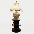 Decorative Table Lamp Featuring Patterned Ceramic Base Black Tiered Stand And Beige Tassel Lampshade