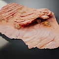 Natural Layered Wood Grain Stone With Red Brown Surface And Textured Details